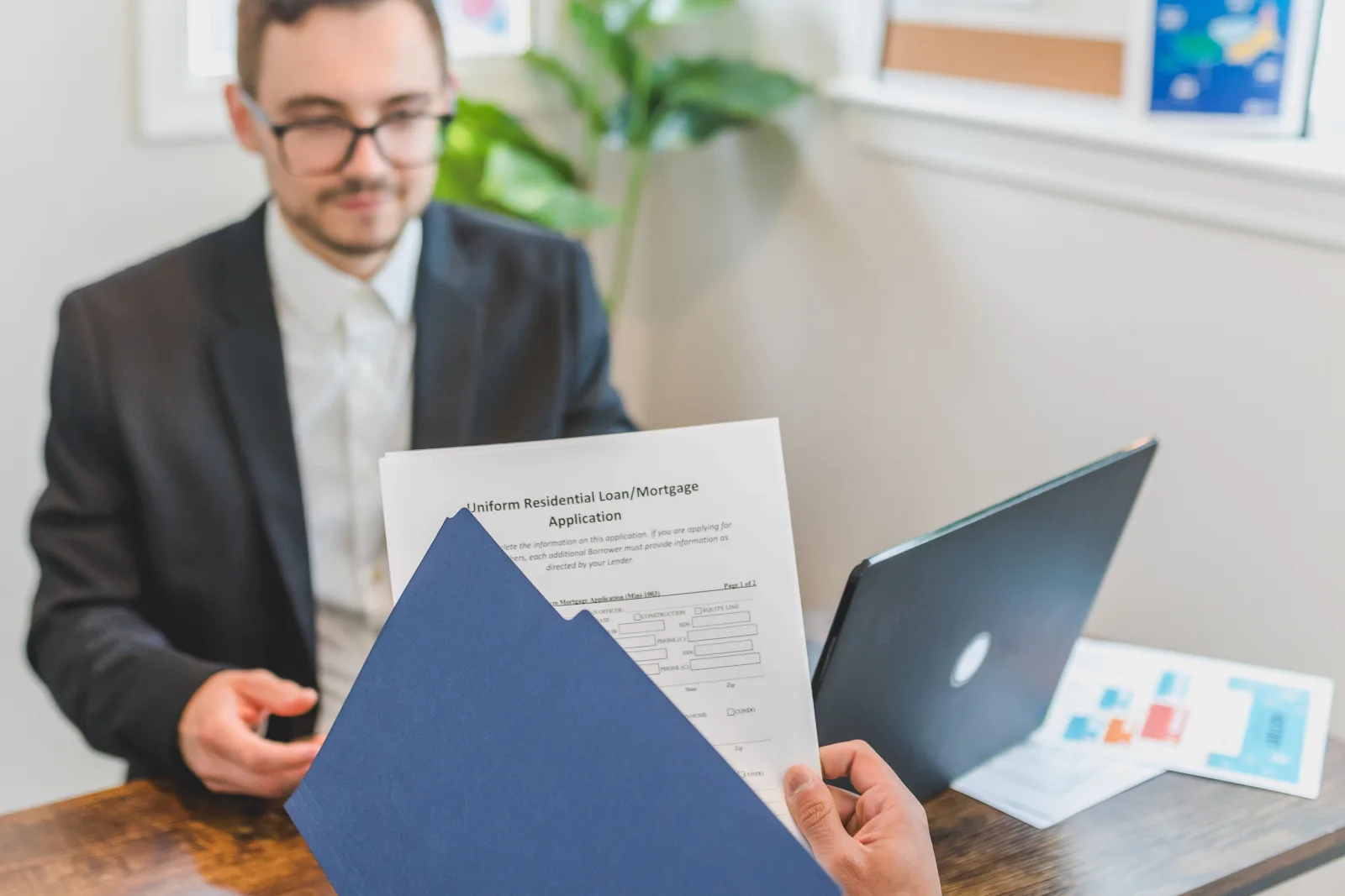 Investor reviewing debt service coverage for a rental property loan.