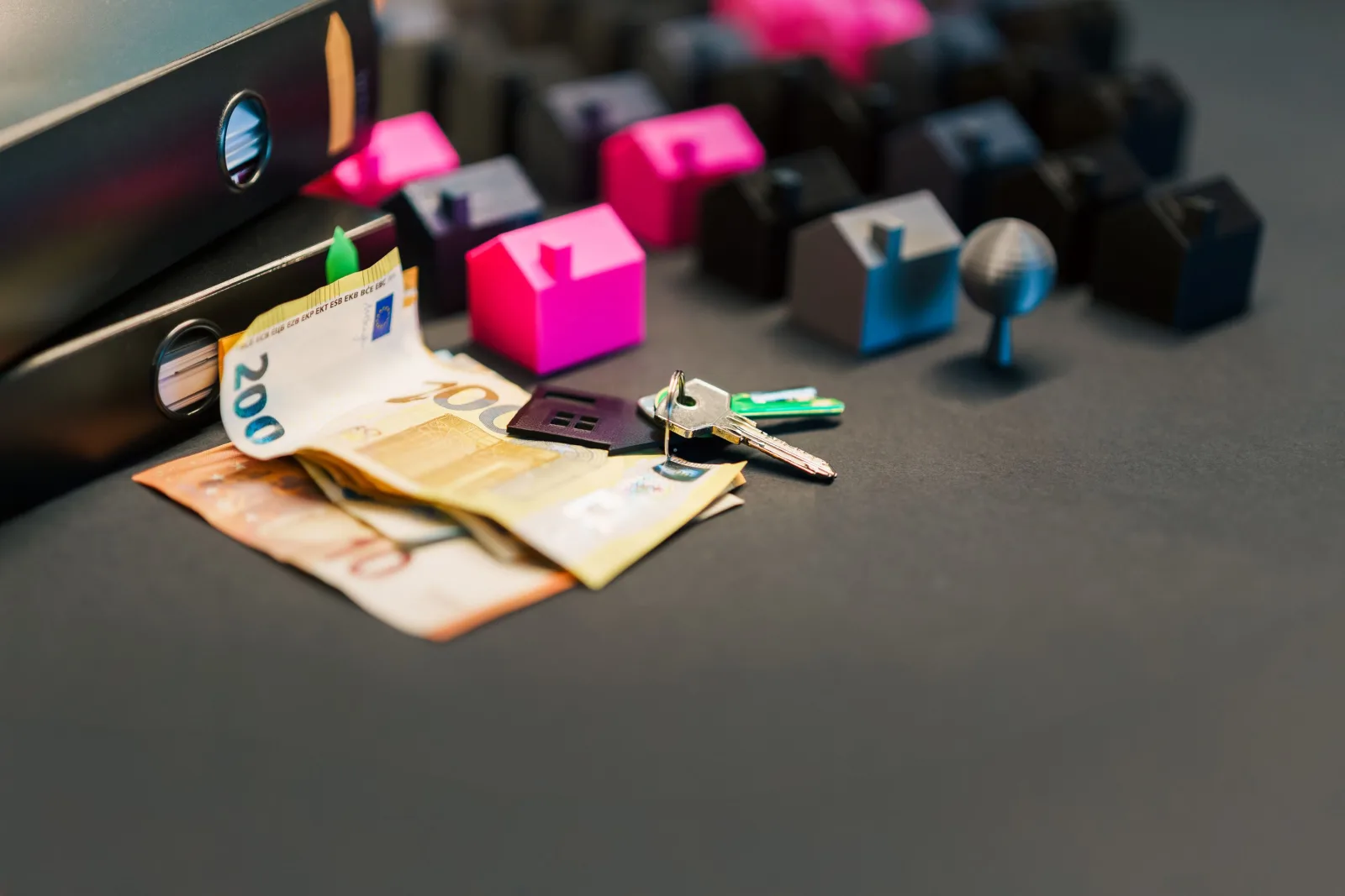 Photo of some keys next to small houses